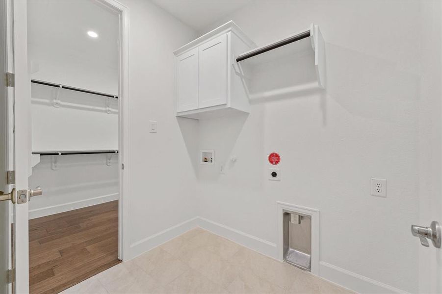 Laundry area with gas dryer hookup, recessed lighting, cabinet space, washer hookup, and hookup for an electric dryer
