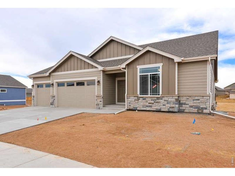 Front exterior of a new home in , Wellington, CO, highlighting curb appeal (Image 1). Front exterior of a new home in , Wellington, CO, highlighting curb appeal (Image 1).
