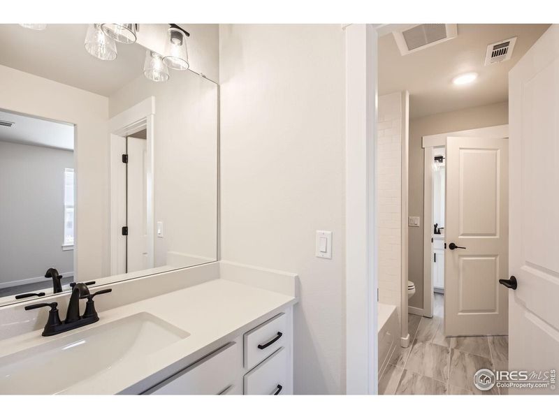 Furnished interior view inside a new home in RainDance, Windsor (Image 5).