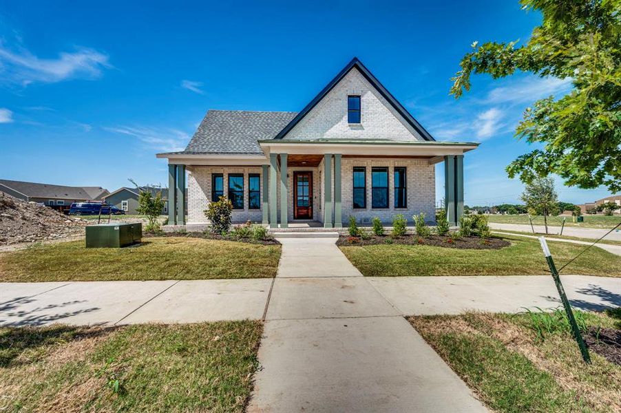 Front exterior of a new home in , Midlothian, TX, highlighting curb appeal (Image 17).