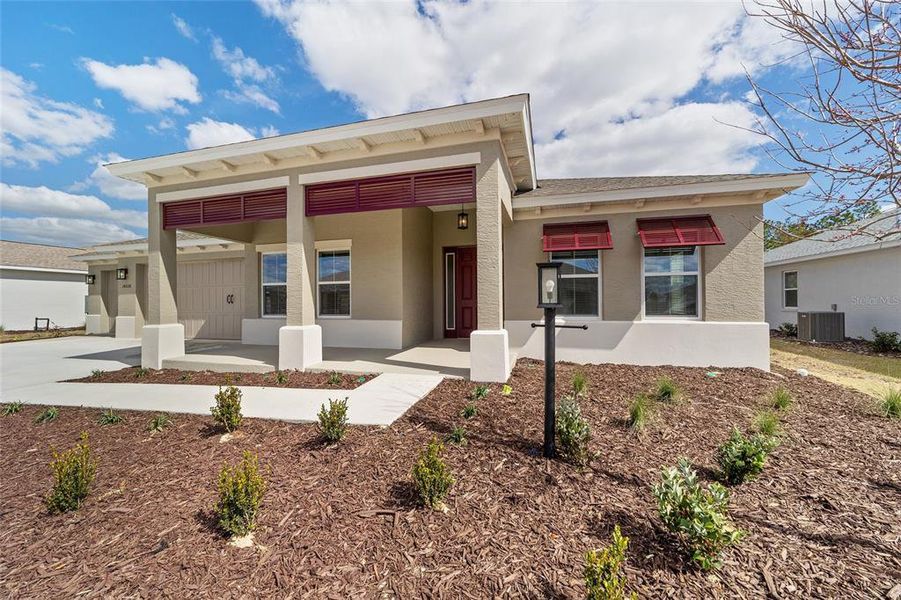Exterior details and patio area of a home in On Top of the World Communities, Ocala (Image 32).