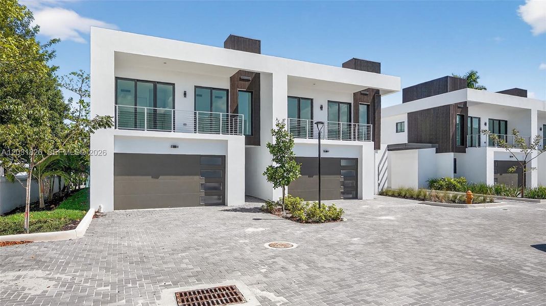 Front exterior of a new home in , Dania Beach, FL, highlighting curb appeal (Image 45).