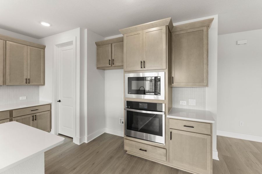 Representative furnished interior of a home built from the Magnolia by Tri Pointe Homes in Treeline, Justin (Image 9).