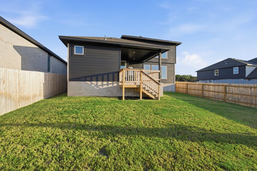 Exterior details and patio area of a home in The Woodlands at Medina Hills, Mico (Image 25).
