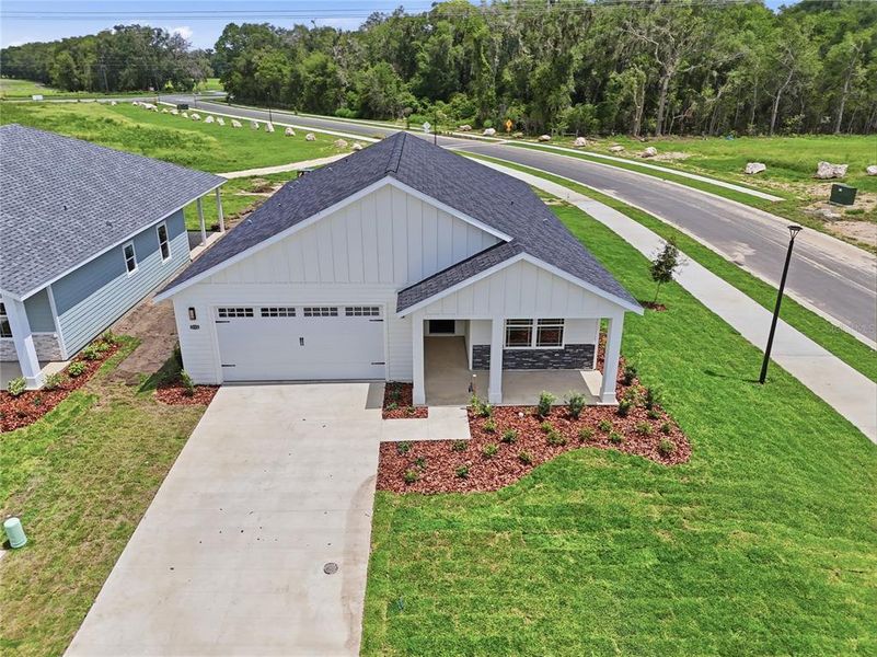 Front exterior of a new home in , Newberry, FL, highlighting curb appeal (Image 19).