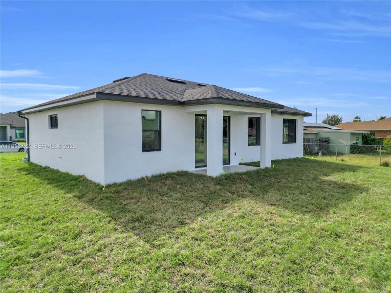 Exterior details and patio area of a home in , Lehigh Acres (Image 30). Exterior details and patio area of a home in , Lehigh Acres (Image 30).
