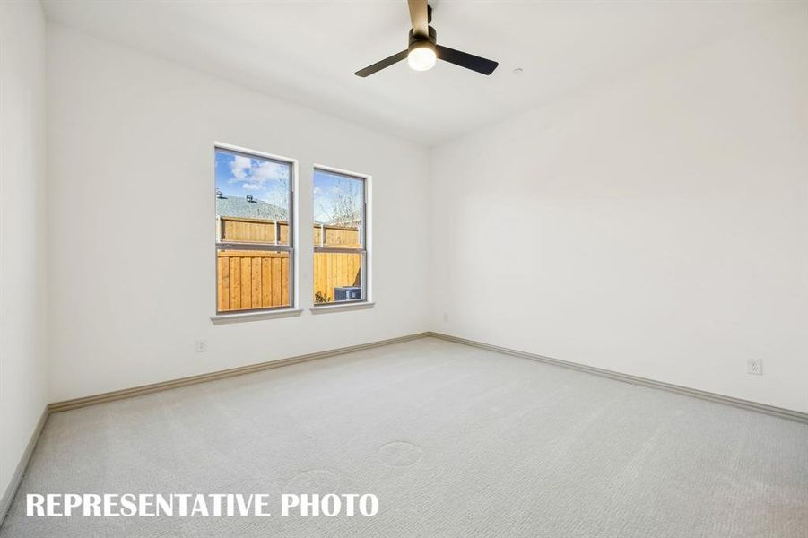 Located on the main level at the rear of the home, this owner's suite was designed for rest and relaxation.  REPRESENTATIVE PHOTO