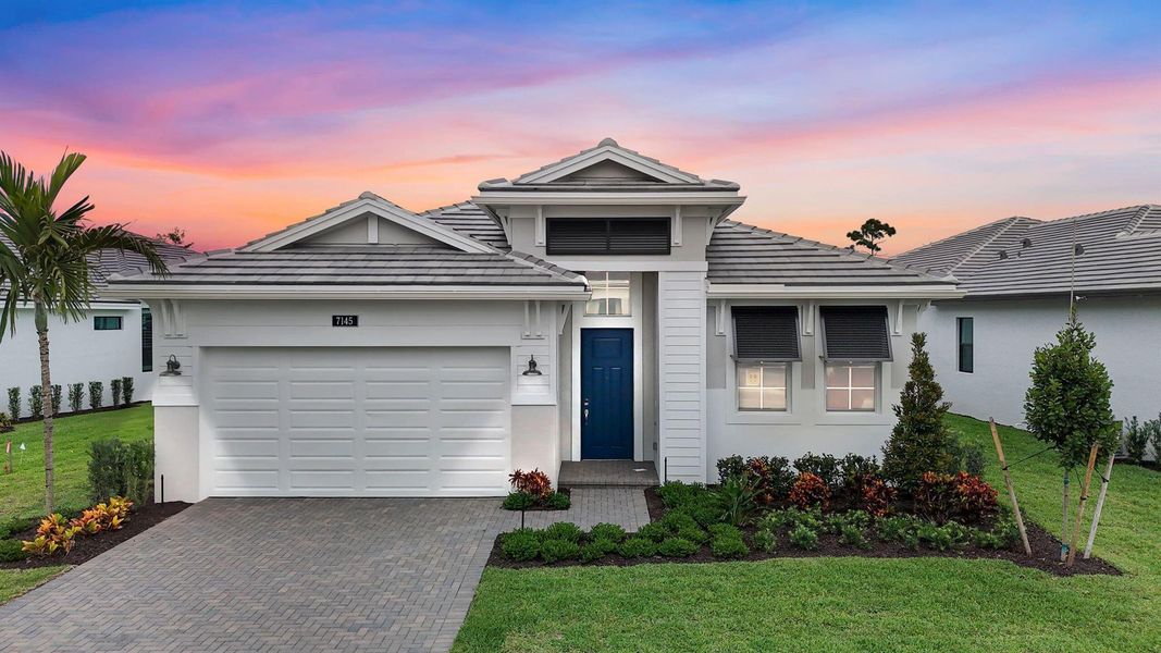 Front exterior of a new home in Cove Royale, Stuart, FL, highlighting curb appeal (Image 21).