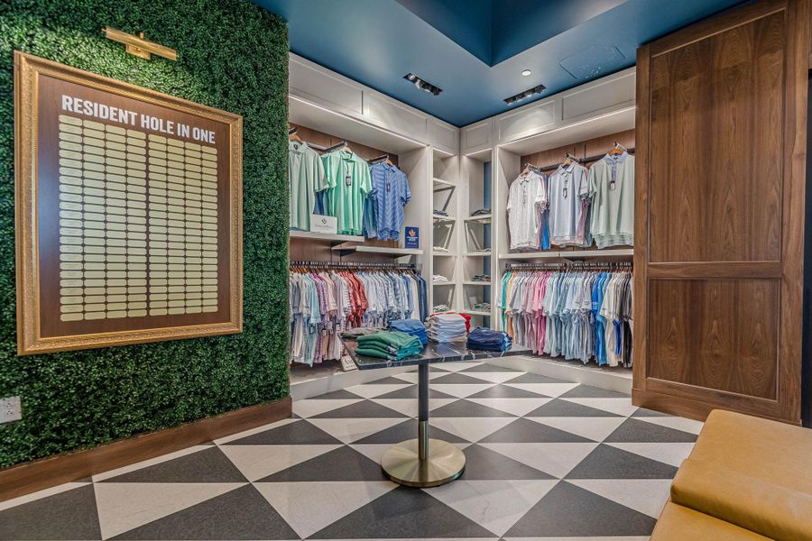Bold black and white checkered flooring grounds this vibrant retail space, featuring custom built-in shelving with ample display opportunities. Bold black and white checkered flooring grounds this vibrant retail space, featuring custom built-in shelving with ample display opportunities.