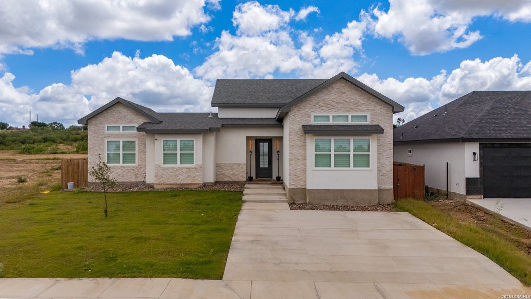 Front exterior of a new home in , Eagle Pass, TX, highlighting curb appeal (Image 24). Front exterior of a new home in , Eagle Pass, TX, highlighting curb appeal (Image 24).
