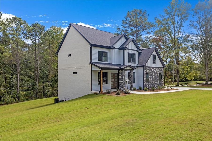 Front exterior of a new home in , Conyers, GA, highlighting curb appeal (Image 1).