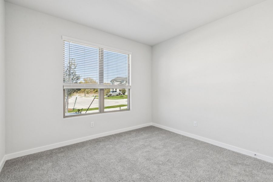 Bedroom in the Winters home plan by Trophy Signature Homes – REPRESENTATIVE PHOTO