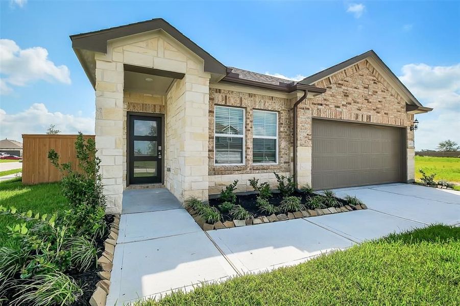 Front exterior of a new home in Emberly, Beasley, TX, highlighting curb appeal (Image 9).