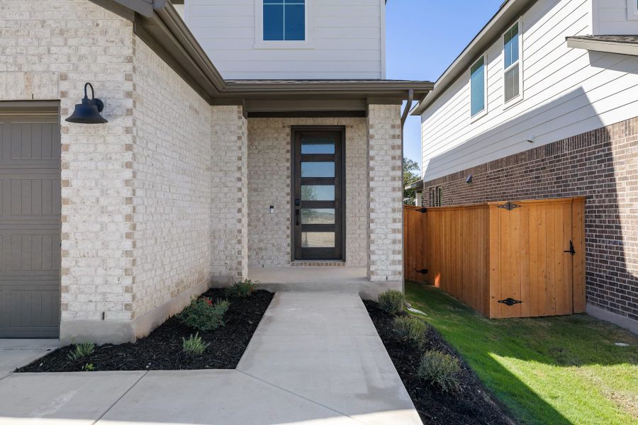 Exterior details and patio area of a home in Lariat, Liberty Hill (Image 3).