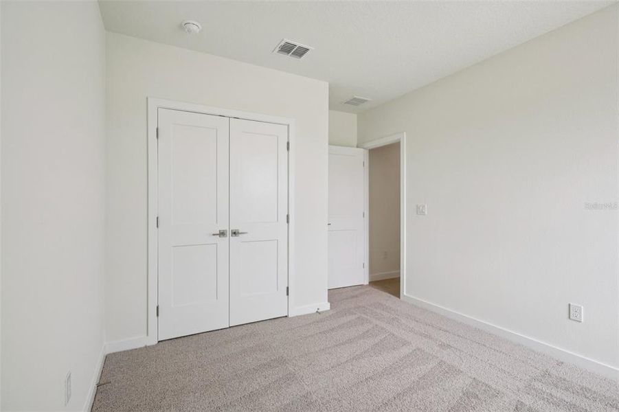 Spacious, unfurnished interior of a new home in Grasslands West, Lakeland (Image 18).
