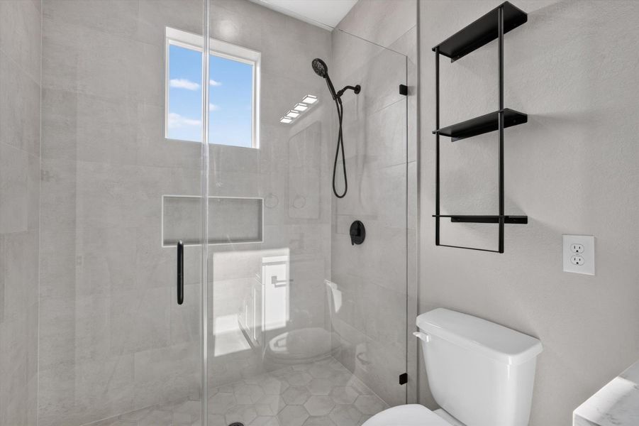 This modern bathroom features a sleek wooden vanity with a white countertop and a rectangular mirror. A neutral gray wall complements the clean design, and a touch of greenery adds a fresh accent. This modern bathroom features a sleek wooden vanity with a white countertop and a rectangular mirror. A neutral gray wall complements the clean design, and a touch of greenery adds a fresh accent.