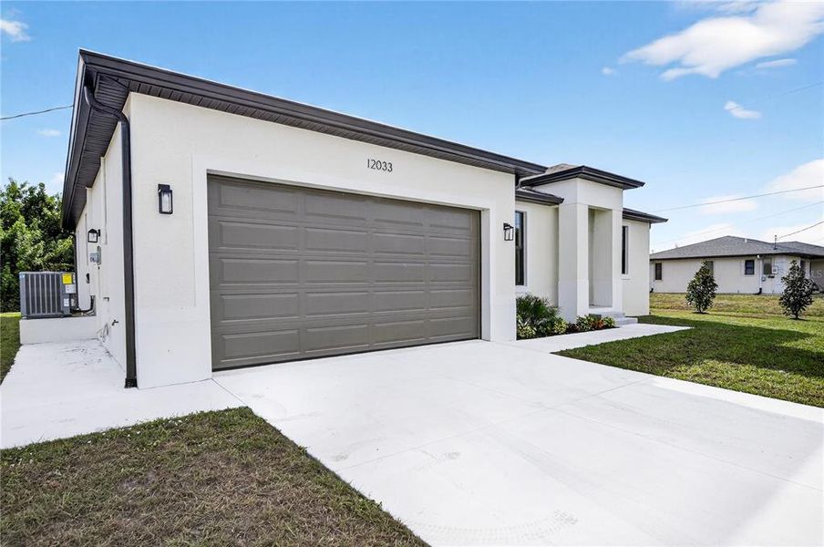 Front exterior of a new home in , North Port, FL, highlighting curb appeal (Image 25).