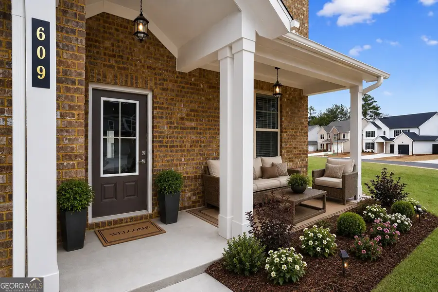 Exterior details and patio area of a home in The Fairways at Mirror Lake, Villa Rica (Image 4). Exterior details and patio area of a home in The Fairways at Mirror Lake, Villa Rica (Image 4).