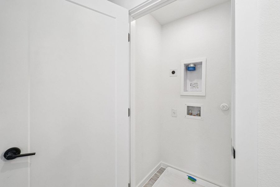 Laundry area featuring washer hookup and hookup for an electric dryer Laundry area featuring washer hookup and hookup for an electric dryer