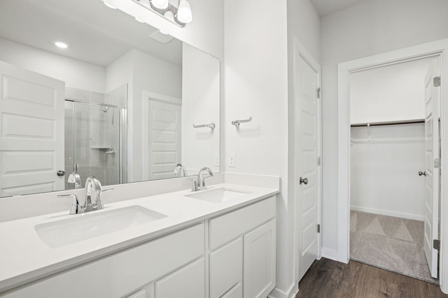 A bathroom with white cabinets. A bathroom with white cabinets.