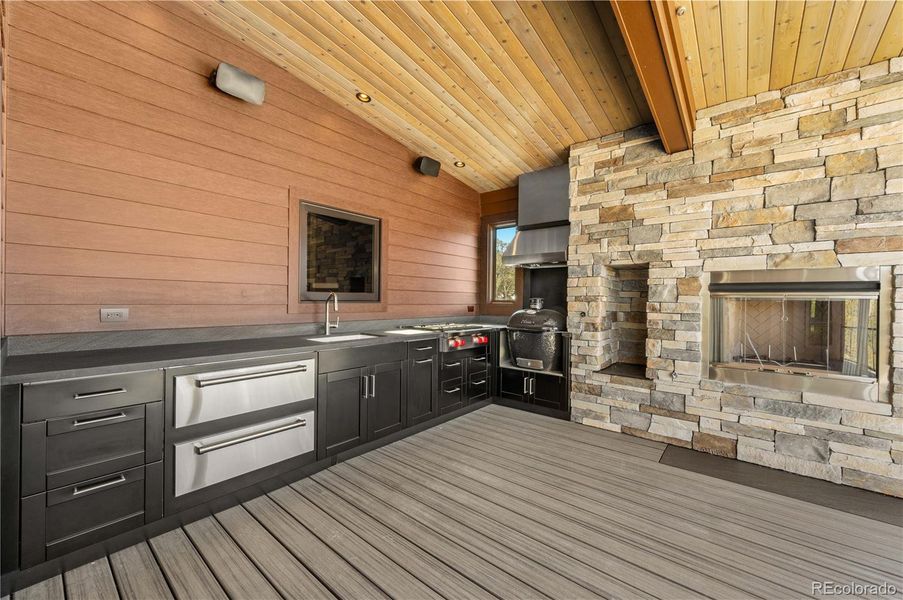 Main floor deck with outdoor kitchen and fireplace Main floor deck with outdoor kitchen and fireplace