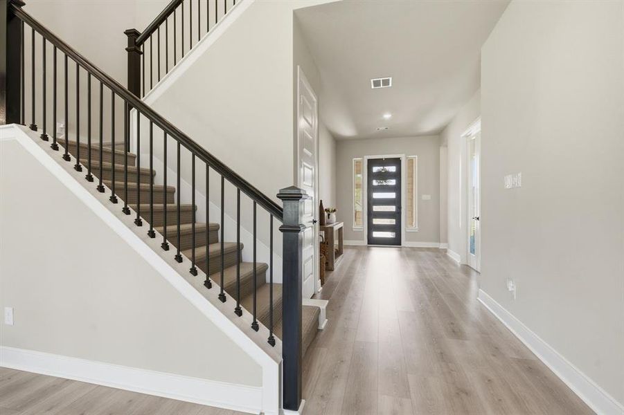 Enter Through A Designer Door To Beautiful, Durable, Easy-Care Composite Flooring That's Used Extensively Downstairs.