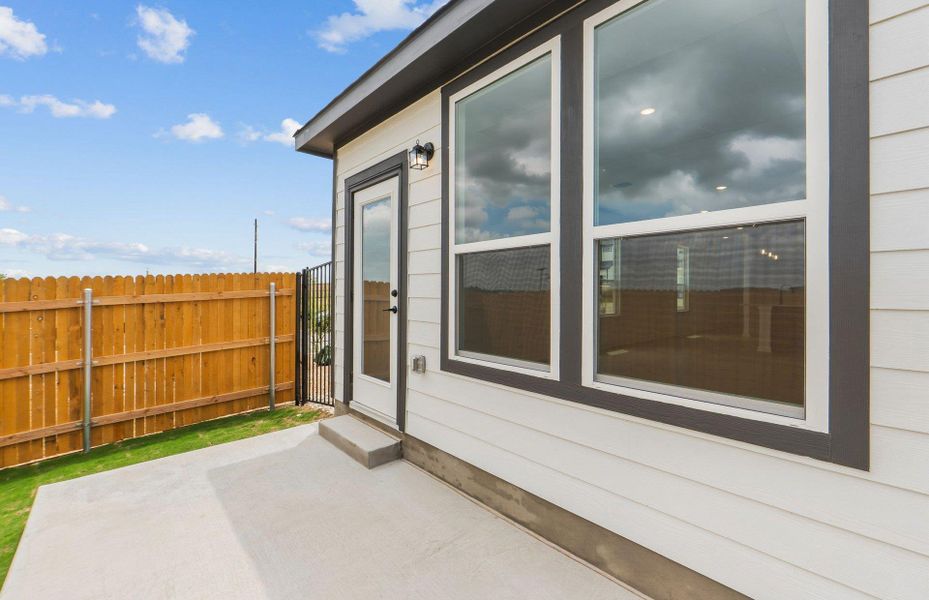 Exterior details and patio area of a home in Cameron Place, Manor (Image 4).