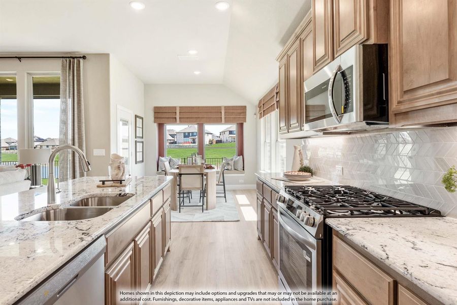Kitchen with wood cabinets, granite countertops, stainless steel appliances, and herringbone tile backsplash open to dining area