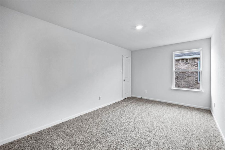 Unfurnished room featuring carpet flooring