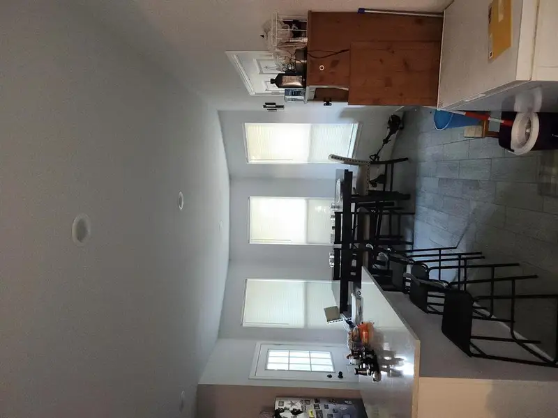 Dining area featuring dark wood-type flooring