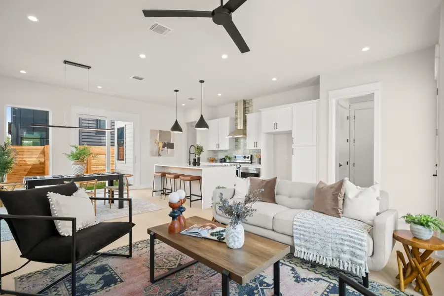 Living room featuring recessed lighting and ceiling fan