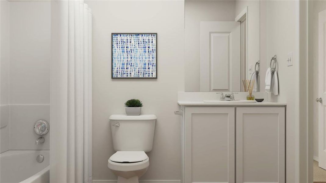 Full bathroom featuring toilet, vanity, and shower / bathtub combination with curtain