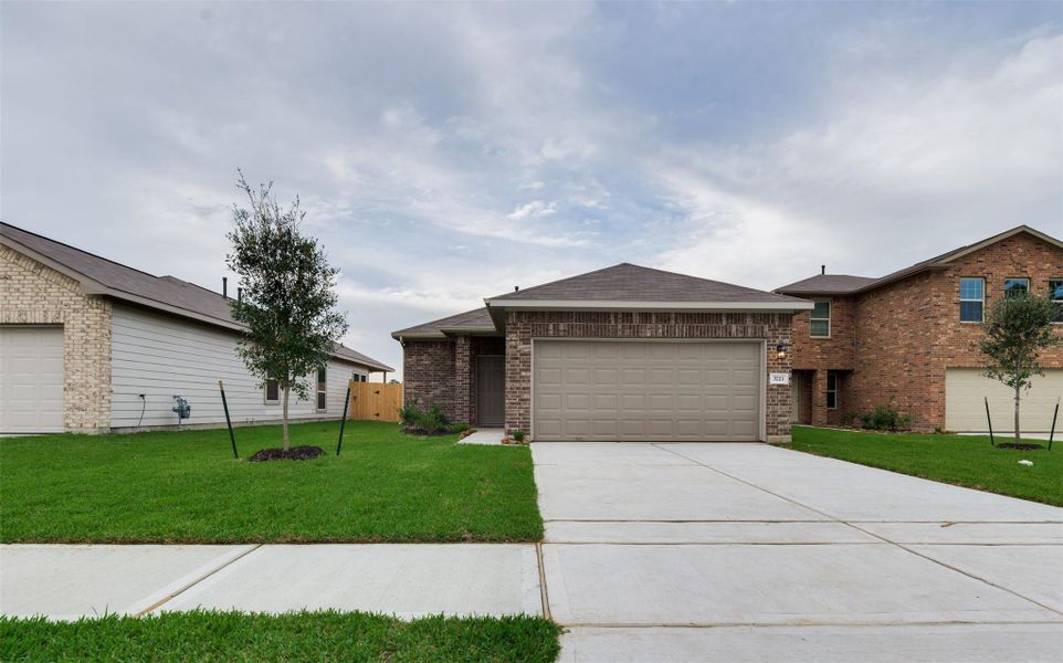 Front exterior of a new home in Mill Creek Trails, Magnolia, TX, highlighting curb appeal (Image 1). Front exterior of a new home in Mill Creek Trails, Magnolia, TX, highlighting curb appeal (Image 1).