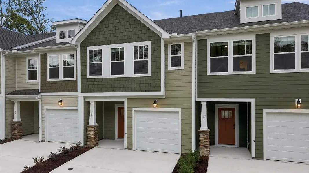 Front exterior of a new home in Brookland Place, Hendersonville, NC, highlighting curb appeal (Image 2). Front exterior of a new home in Brookland Place, Hendersonville, NC, highlighting curb appeal (Image 2).