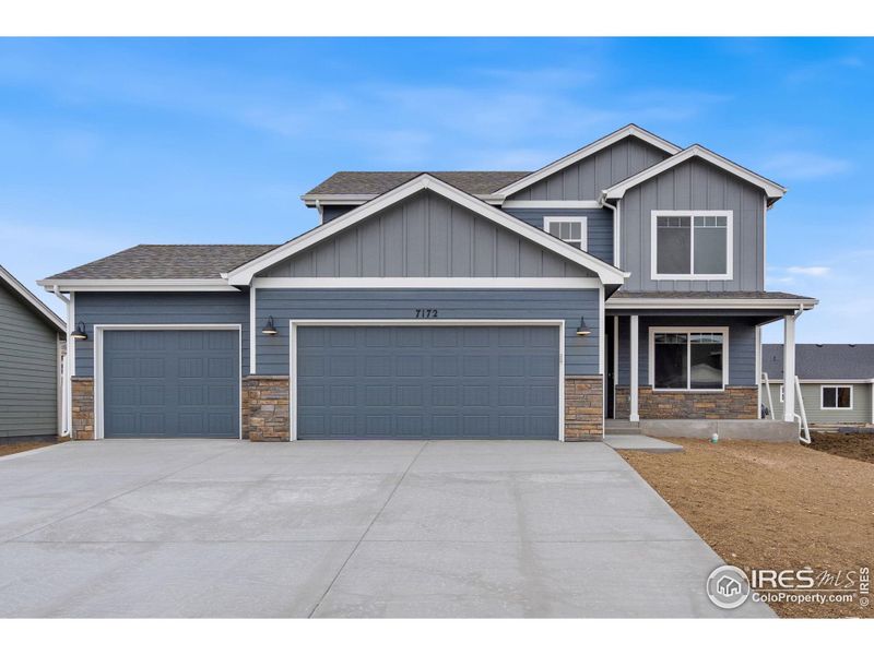 Front exterior of a new home in , Wellington, CO, highlighting curb appeal (Image 18).