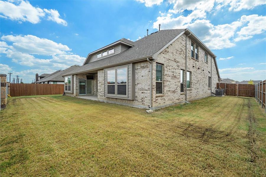 Exterior details and patio area of a home in Fox Hollow, Forney (Image 4).