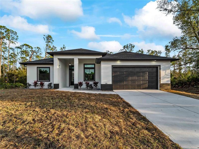 Front exterior of a new home in , Port Charlotte, FL, highlighting curb appeal (Image 29).