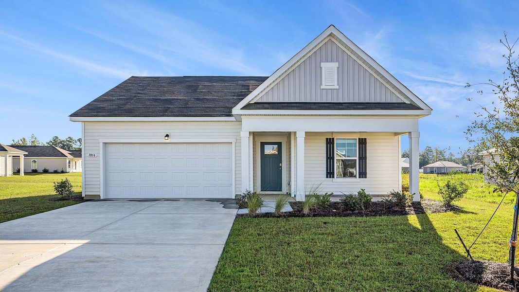 Front exterior of a new home in Auberon Woods, Conway, SC, highlighting curb appeal (Image 1).