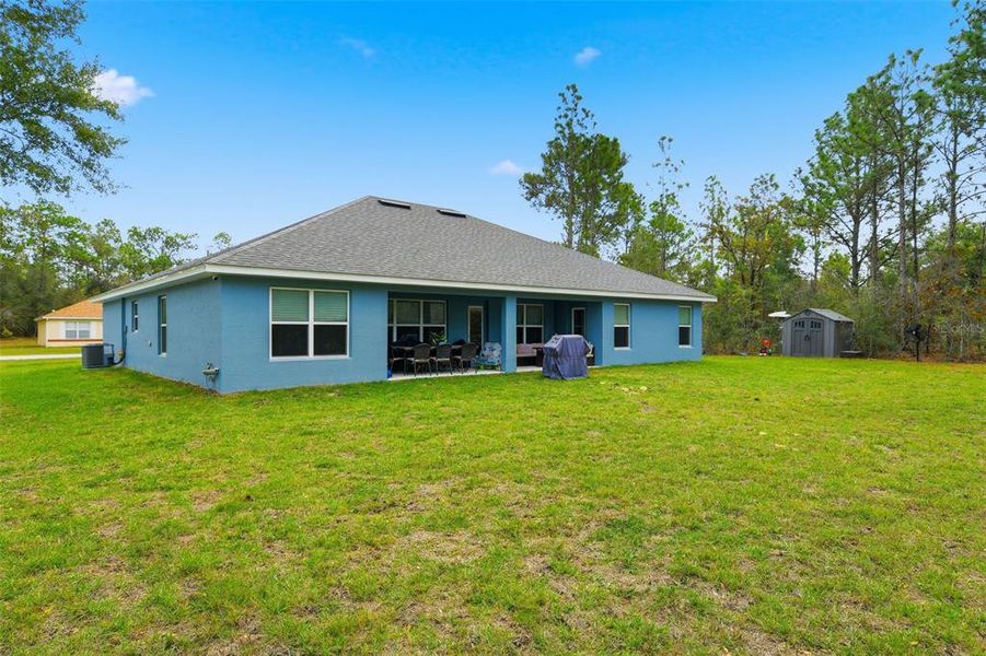 Exterior details and patio area of a home in Royal Highlands, Weeki Wachee (Image 30).