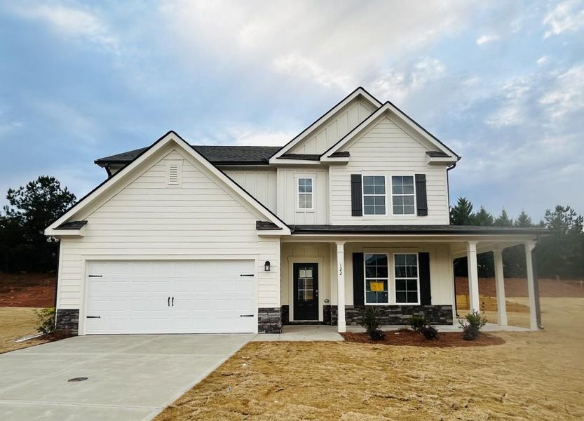 Front exterior of a new home in Sutton's Landing, Statham, GA, highlighting curb appeal (Image 1). Front exterior of a new home in Sutton's Landing, Statham, GA, highlighting curb appeal (Image 1).
