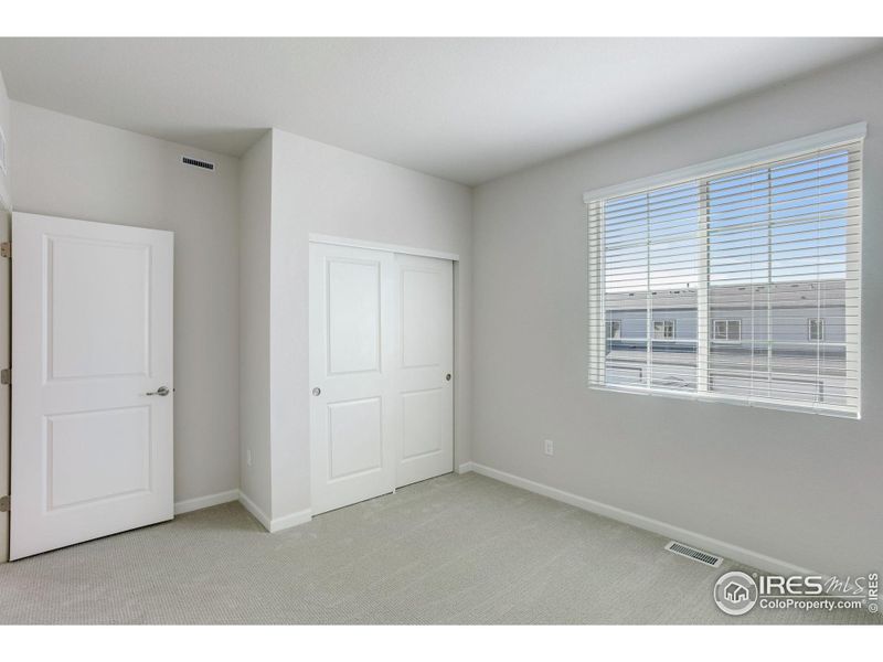 Spacious, unfurnished interior of a new home in Westside Crossing Townhomes, Berthoud (Image 31).