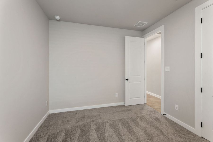 Representative unfurnished interior of a home built from the Pecos by Hakes Brothers in Highland Ridge, New Braunfels (Image 35).