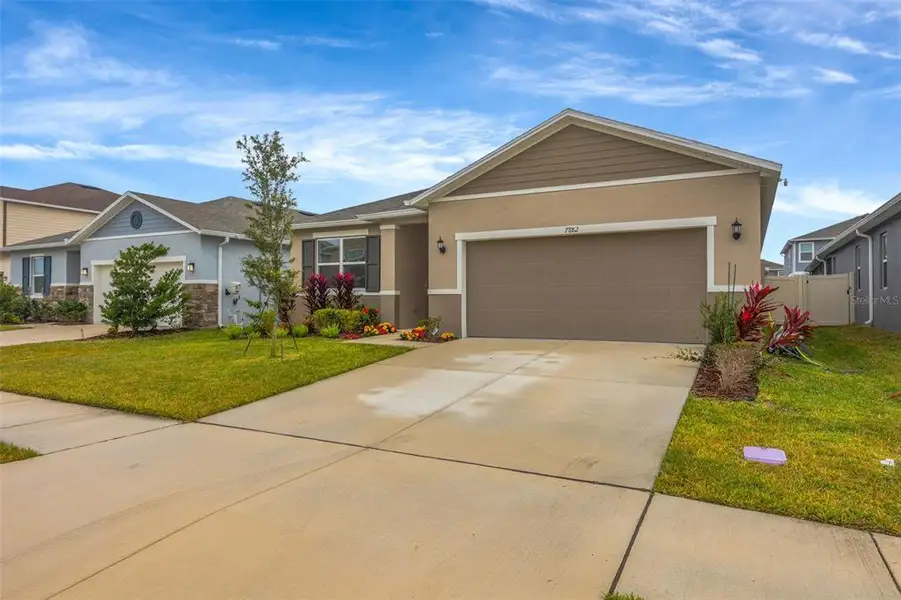 Front exterior of a new home in , Wesley Chapel, FL, highlighting curb appeal (Image 1). Front exterior of a new home in , Wesley Chapel, FL, highlighting curb appeal (Image 1).