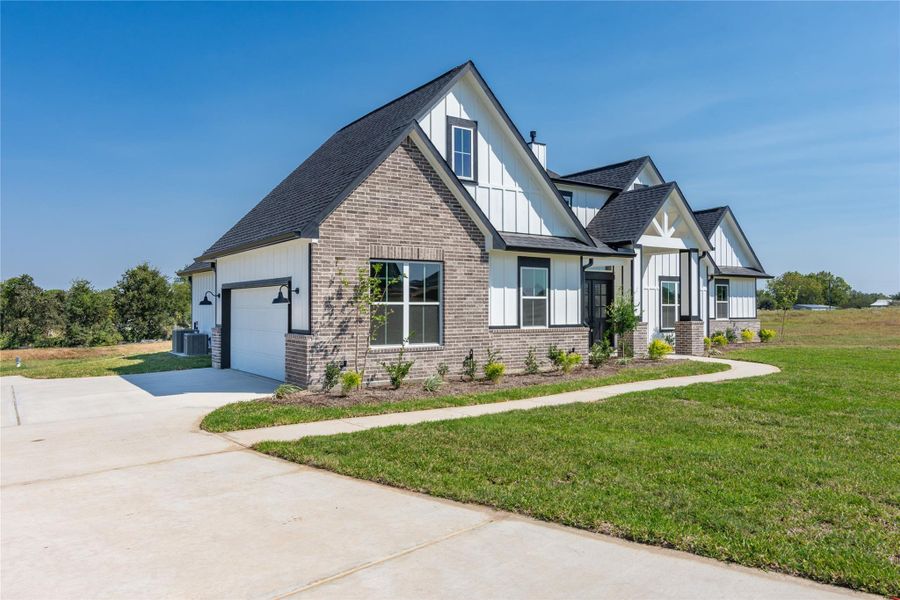 Front exterior of a new home in , Chappell Hill, TX, highlighting curb appeal (Image 23).