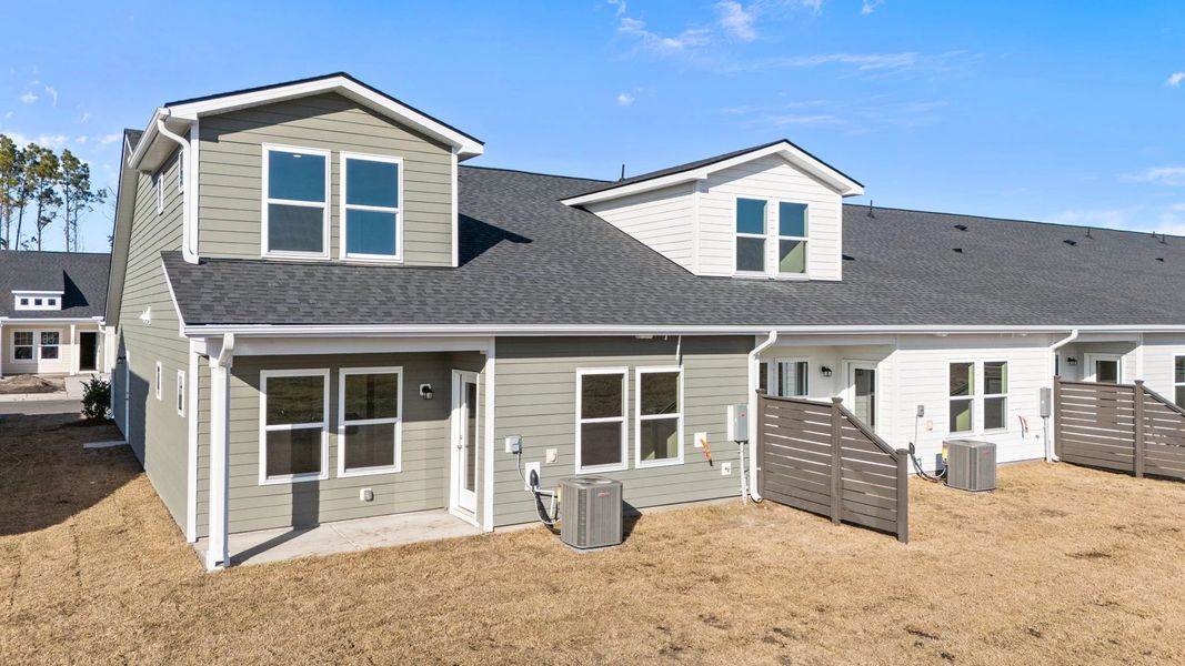 Exterior details and patio area of a home in Blue Heron Retreat, Little River (Image 17).