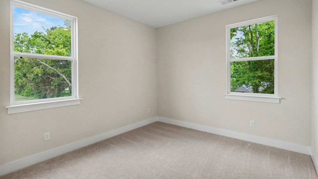 Bedroom with carpet and windows Bedroom with carpet and windows