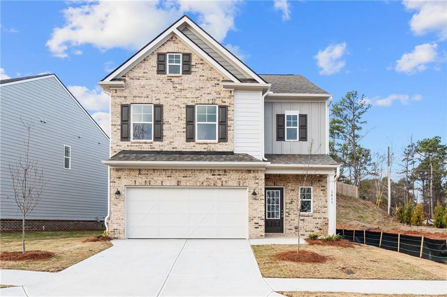 Front exterior of a new home in , Flowery Branch, GA, highlighting curb appeal (Image 1).