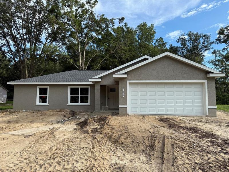 Front exterior of a new home in , Ocala, FL, highlighting curb appeal (Image 22).