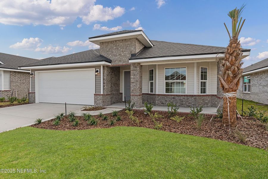 Front exterior of a new home in Shadow Crest at Rolling Hills, Green Cove Springs, FL, highlighting curb appeal (Image 2). Front exterior of a new home in Shadow Crest at Rolling Hills, Green Cove Springs, FL, highlighting curb appeal (Image 2).
