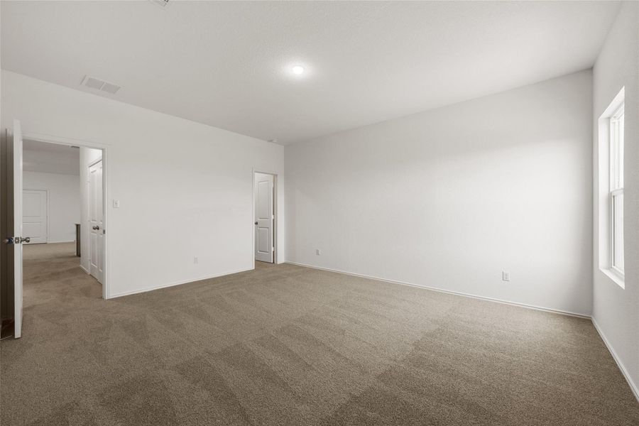 Empty room with carpet floors and baseboards Empty room with carpet floors and baseboards